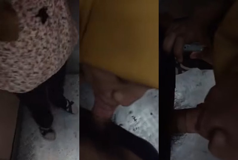 A woman wearing a headscarf in Kuantan is sucking in the elevator.