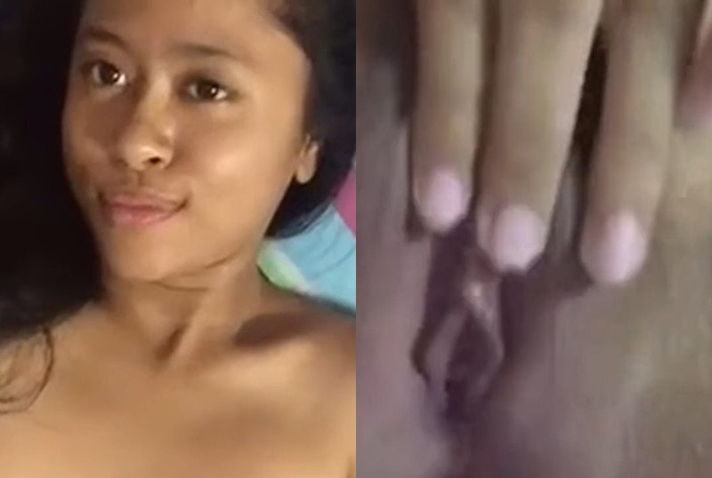 A beautiful Malaysian girl is teasing you by playing with her cat.