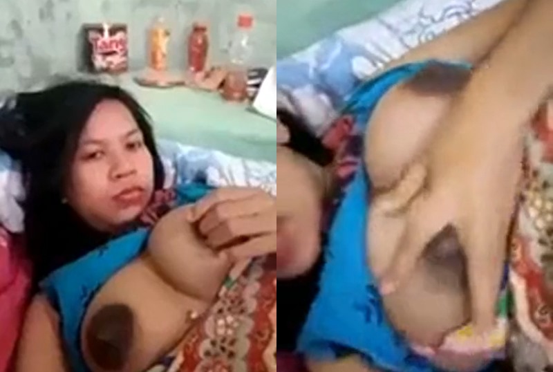 The lady is showing her big breasts.